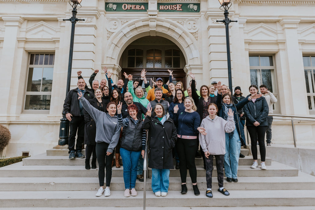 The Topflite team photographed on the steps of the historic Oamaru opera house.